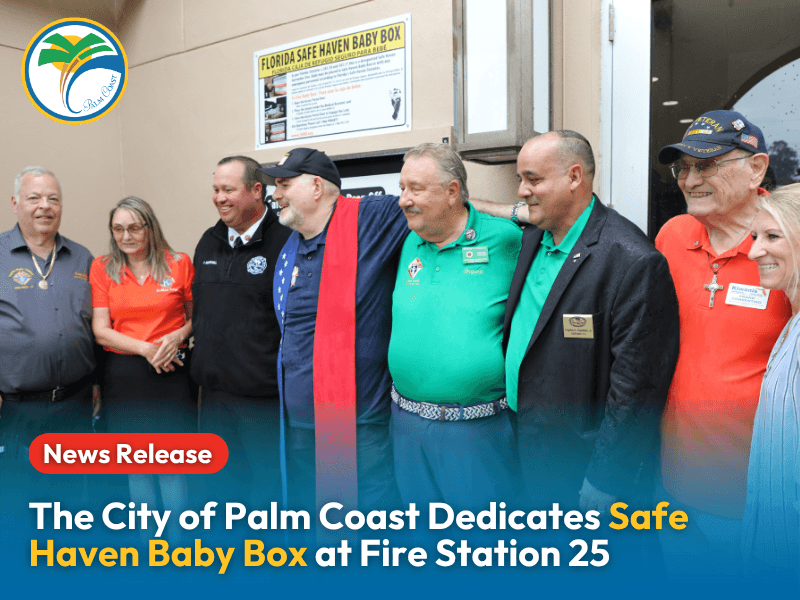 Group photo of City officials, Knights of Columbus, and Kiwanis Members at Fire Station 25 for Safe Haven Baby Box Dedication